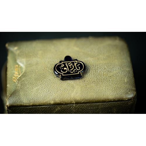 132 - A BLACK STONE PENDANT WITH ARABIC INSCRIPTION IN GOLD, AUSTRIA, FOR OTTOMAN MARKET, Of oval form, Ar... 