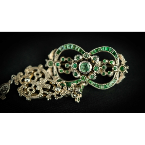 133 - A splendid vari- cut enemal brooche Early 20th century, Of open work design set with emeralds and fl... 