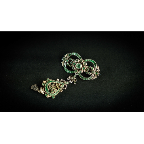 133 - A splendid vari- cut enemal brooche Early 20th century, Of open work design set with emeralds and fl... 