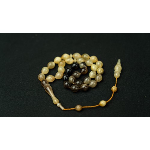 61 - The tasbih strung  with 33  ovoid  beads, flat stops, narrowing and nicely elongating imama,  precee... 