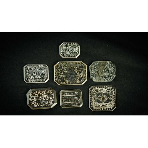 143 - A SET OF ROCK CRYSTAL TALISMANIC AND QUR’ANIC INTAGLIO PLAQUES, A group of rock crystal intaglio pla... 