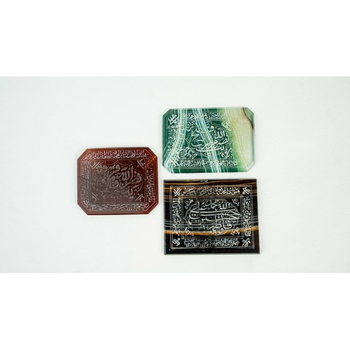 144 - A SET OF AGATE PLAQUES WITH ARABIC INSCRIPTIONS, Consisting of rectangular forms in various colours,... 