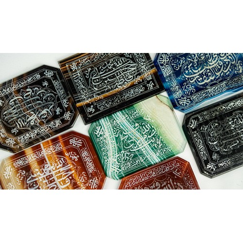 144 - A SET OF AGATE PLAQUES WITH ARABIC INSCRIPTIONS, Consisting of rectangular forms in various colours,... 