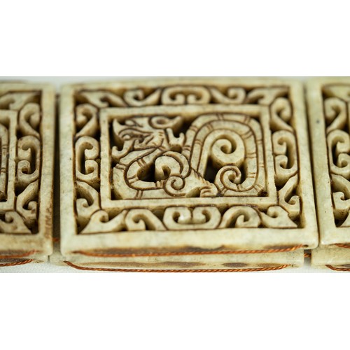 149 - TWO HARDSTONE DRAGON CARVED CHAIN BELTS, INDIA, Each formed of fourteen panels of rectangular form, ... 