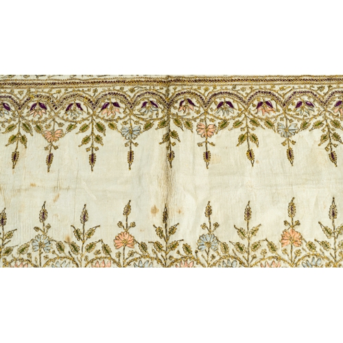 100 - A GOLD AND SILK EMBROIDERED SILK RUNNER, INDIA 20TH CENTURY, Of rectangular form, plain centre surro... 