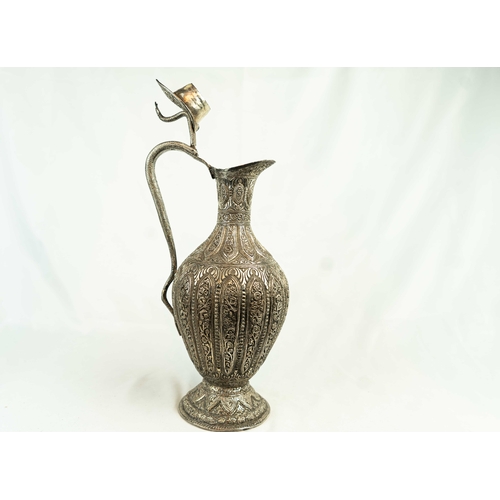 110 - AN ANGLO – INDIAN SILVER-PLATED COPPER JUG, KASHMIR, 19TH CENTURY, Of bulbous form, resting on a tap... 