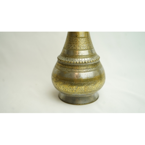 120 - AN INDIAN BRASS BOTTLE, INDIA, 19TH CENTURY, Of pyriform form, the globular body resting on sprayed ... 