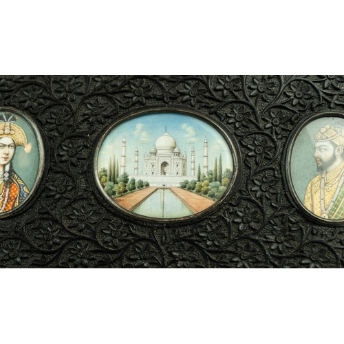 132 - MUGHAL PAINTINGS IN EBONY FRAMES, 19TH CENTURY, INDIA, Of rectangular form, three profusely carved e... 