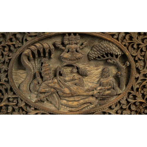 20 - A CARVED WOODEN BOX, EARLY 20TH CENTURY, INDIA, Of rectangular form, featuring intricate carvings de... 