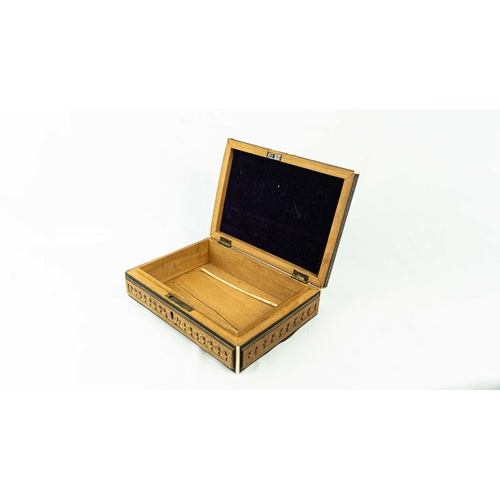 22 - AN ENGRAVED WOODEN BOX WITH A LANDSCAPE, Of rectangular form, a wooden box with a hinged lid, restin... 