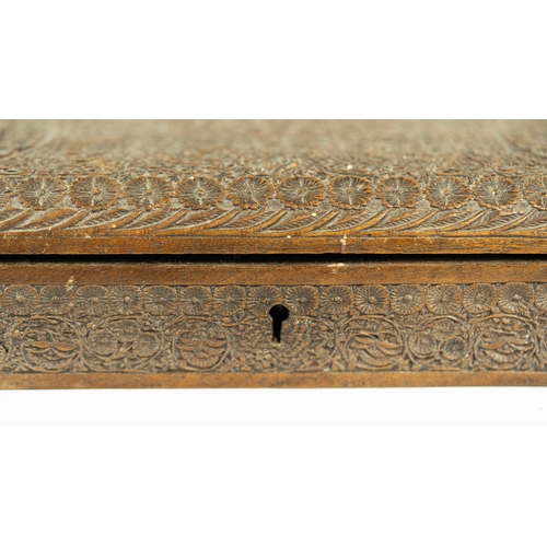 24 - AN INTRICATELY CARVED BOX, INDIA, Of rectangular form, resting on flat base, surmounted by a hinged ... 