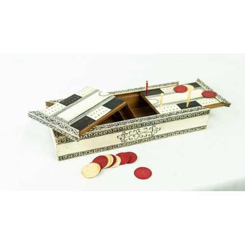 48 - AN ANGLO-INDIAN BONE AND SADELI-WARE GAMEBOX WITH CHECKERS, Of rectangular form, the top with a crib... 