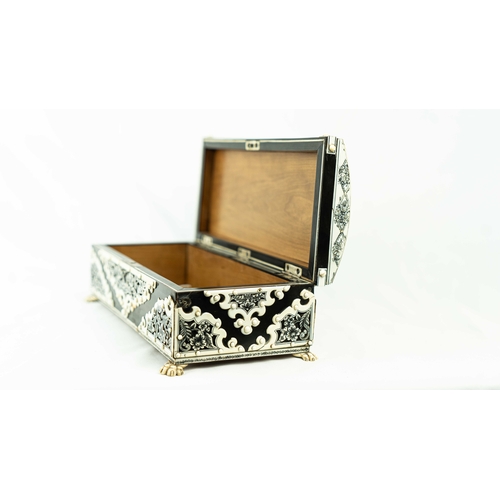 50 - AN ANGLO-INDIAN BONE INLAID BOX, Of rectangular form, resting on bone paw feet, the exterior decorat... 