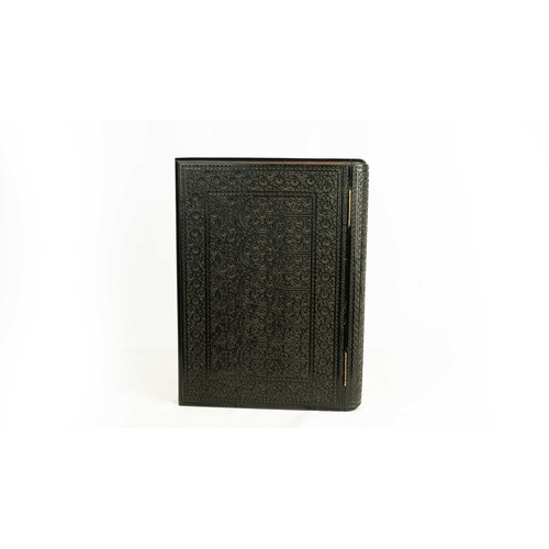 52 - A LAVISHLY CARVED EBONY BOOK BINDING, INDIA, 19TH CENTURY, Of rectangular form, book binding with hi... 