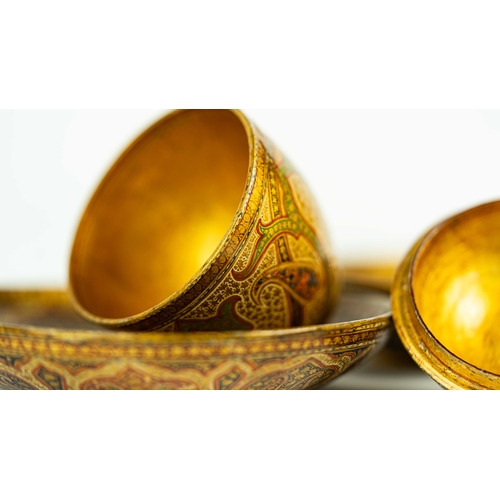 56 - A SET OF KASHMIRI PAPIER MACHE, A globular sugar bowl with two matching saucers, decorated with typi... 