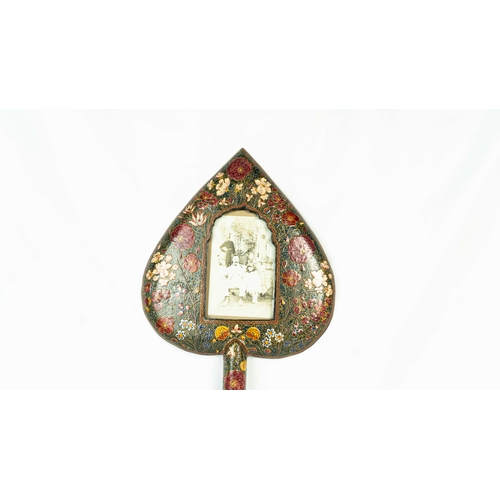 65 - A KASHMIRI PAPIER MACHÉ PHOTO FRAME , 19th CENTURY, INDIA, Of heart shape form with a long handle, i... 