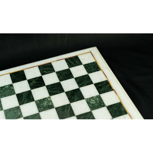 4 - AN INLAID MARBLE CHESS BOARD, Of square form, black and white checkered marble game board, outlined ... 