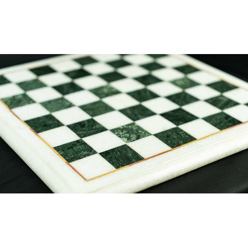 4 - AN INLAID MARBLE CHESS BOARD, Of square form, black and white checkered marble game board, outlined ... 