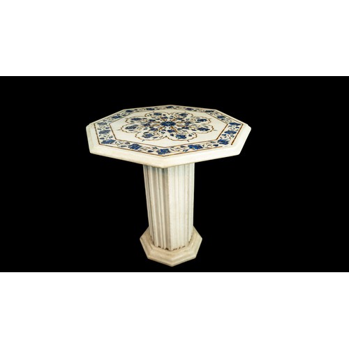 8 - AN INLAID MARBLE COFFEE TABLE, The table top of octagonal form, delicately inlaid with semi-precious... 