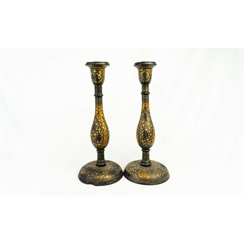 84 - A PAIR OF KASHMIRI LACQUERED CANDLESTICKS, 19TH CENTURY, Each of baluster form, resting on domed foo... 