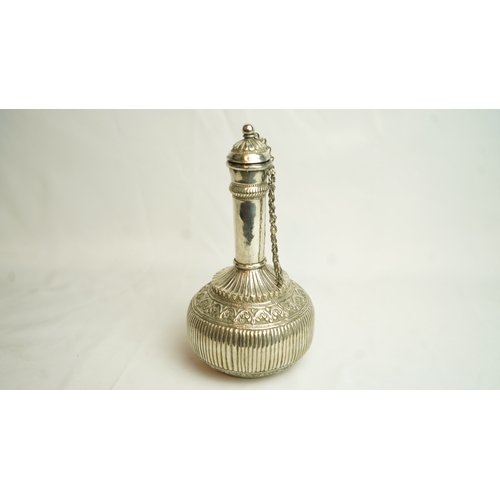 88 - AN OMANI WHITE METAL SURAHI, ROSE WATER FLASK, Of bulbous form, sitting on a circular base, its slen... 