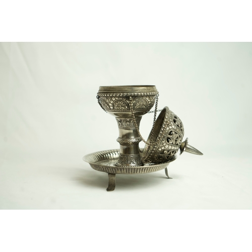 93 - A PIERCED WHITE METAL INCENSE BURNER, Of baluster shape, resting on a narrow-waisted foot on a circu... 