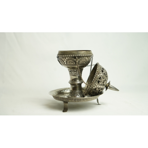 93 - A PIERCED WHITE METAL INCENSE BURNER, Of baluster shape, resting on a narrow-waisted foot on a circu... 