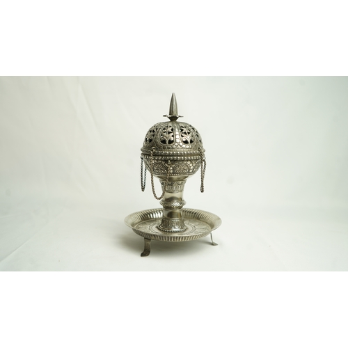 93 - A PIERCED WHITE METAL INCENSE BURNER, Of baluster shape, resting on a narrow-waisted foot on a circu... 