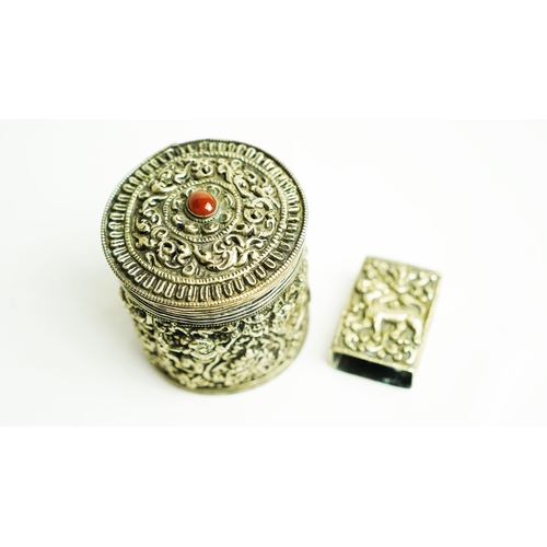 152 - A SILVER CIGARETTE BOX WITH A MATCHING MATCH BOX COVER, Of circular form, the body exquisitely embos... 