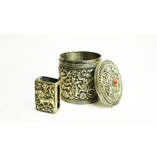 152 - A SILVER CIGARETTE BOX WITH A MATCHING MATCH BOX COVER, Of circular form, the body exquisitely embos... 