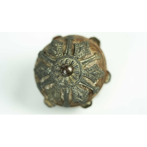 154 - POSSIBLY A CANE KNOB, Of globular form, the leather cane knob surmounted with silver decoration with... 