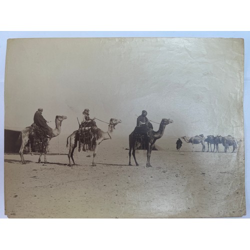 20 - A CAPTIVATING
 19TH CENTURY PHOTOGRAPH CAPTURING CAMELS AND THEIR RIDERS, CIRCA, 1870-1890
The photo... 