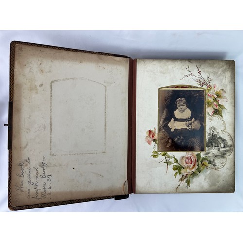 75 - A VICTORIAN
 PHOTO ALBUM WITH A MUSICAL BOX WITH 6 MUSIC DISCS 
Leather bound, a Victorian photo alb... 