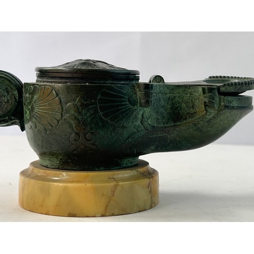 6 - A BRONZE 
INCENSE BURNER WITH MARBLE BASE

Featuring a circular main body, the lid with a mythologic... 