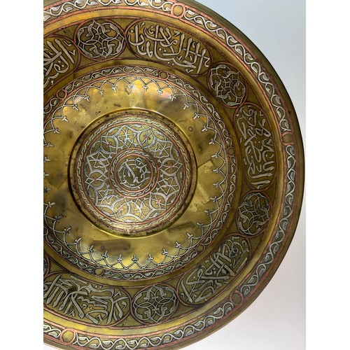 11 - A MAMLUK STYLE REVIVAL, LARGE SILVER INLAID BOWL,
SYRIA,
19TH CENTURY

Of circular form, resting on ... 