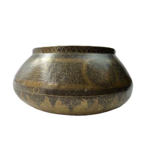 14 - A BRASS BOWL

Of compressed form, resting on a concave base, tapering to a narrow rim, the exterior ... 