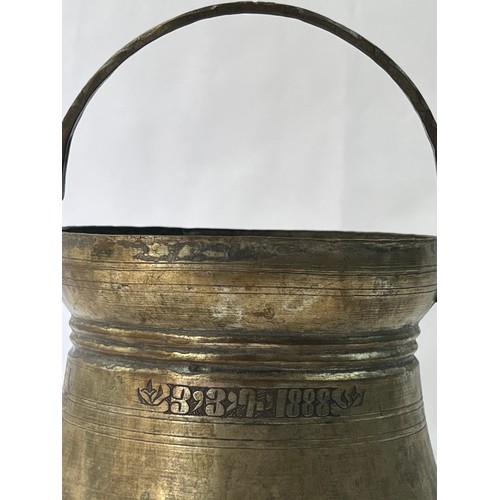 17 - AN ARMENIAN COPPER BUCKET

Of typical form, dated 3/3/1888 510 gr
13 cm mouth dia
approx..14 cm high