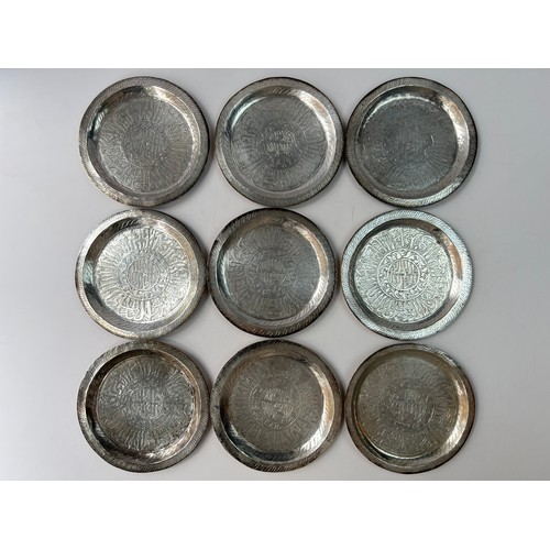 18 - NINE ENGRAVED COPPER PLATES

Rounded form, silver colour, inside three bands, band of scrolling bran... 