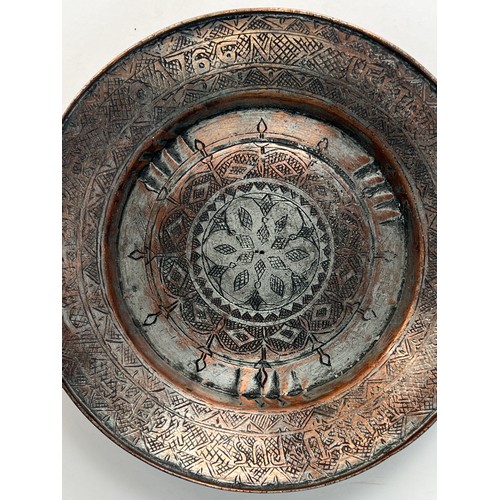 19 - ARMENIAN COPPER PLATE

Of circular form, resting on short foot, a central medallion chased with band... 