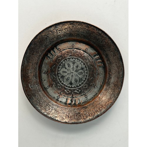 19 - ARMENIAN COPPER PLATE

Of circular form, resting on short foot, a central medallion chased with band... 