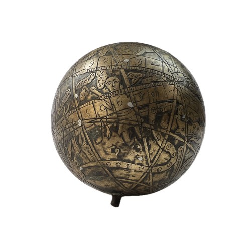 A BRASS CELESTIAL GLOBE , INDIA, 20th CENTURY

Of spherical shape, engraved brass celestial globe, featuring silver inlay to show the constellations represented by mythical features, pierce on either end of the main axis, missing the cast ring.             515 gr
12 cm dia