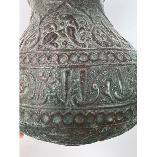 23 - A KHURASSAN  VASE
Of bulbous form, resting on a flat base, a large everted rim, both exterior and in... 