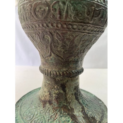 23 - A KHURASSAN  VASE
Of bulbous form, resting on a flat base, a large everted rim, both exterior and in... 