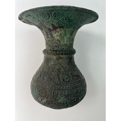 23 - A KHURASSAN  VASE
Of bulbous form, resting on a flat base, a large everted rim, both exterior and in... 