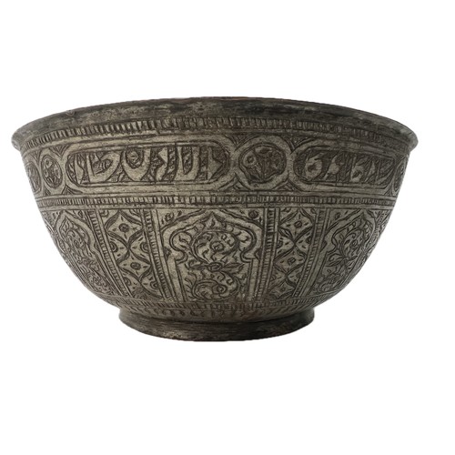 24 - A BRASS ENGRAVED  BOWL
Of rounded form, resting on short foot, engraved with panels of interlocking ... 