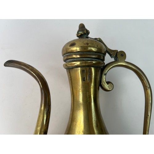 26 - A RUSSIAN BRASS EWER FOR OTTOMAN MARKET

Of baluster form with a pear-shaped body resting on a short... 