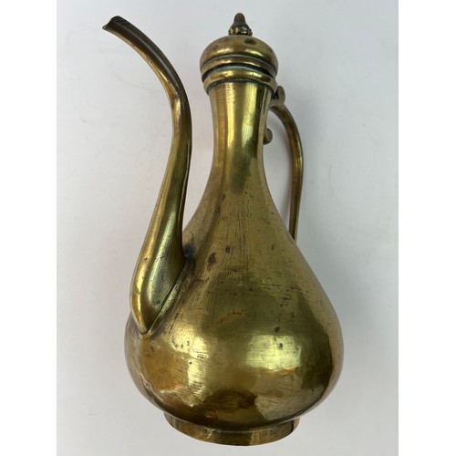 26 - A RUSSIAN BRASS EWER FOR OTTOMAN MARKET

Of baluster form with a pear-shaped body resting on a short... 