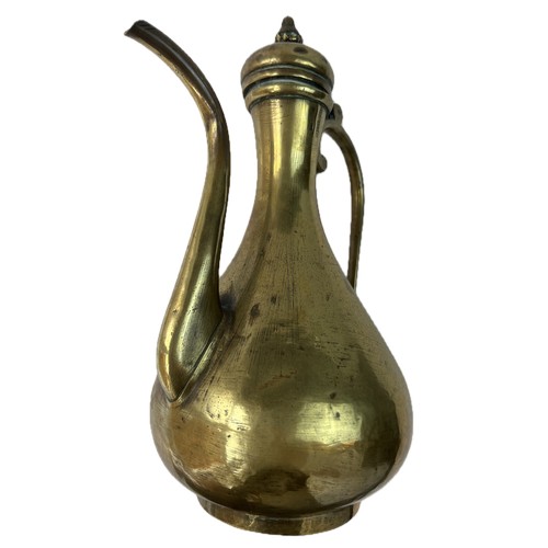 26 - A RUSSIAN BRASS EWER FOR OTTOMAN MARKET

Of baluster form with a pear-shaped body resting on a short... 