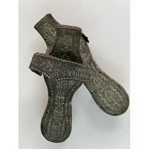 27 - A PAIR OF METAL FILIGREE WORK HAMMAM SLIPPERS, OTTOMAN EMPIRE

Of typical shape, the wood decorated ... 