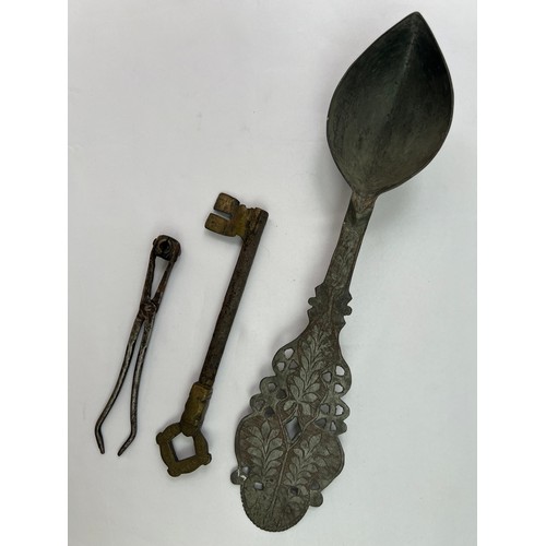 35 - A MIX GROUP OF METAL WORKS

A large ladle with a pointy bowl tip, the handle decorated with stylised... 